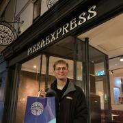 Zac Lewis in front of Pizza Express
