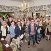 Stratton House owner Aidan (centre) led the raising of glasses to the new look Stratton House Hotel Restaurant