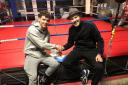 Swindon’s Lewis Roberts (left) with trainer Paddy Fitzpatrick after signing his first professional deal during November 2022