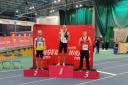 Matt Woodward (centre) on the of the podium at the Welsh Indoor Championships after winning the 1500m Pic: Swindon Harriers