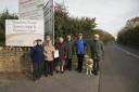 Residents from Fitzwarren Court who are stuck in their homes with no path to use to get to the bus stop Pictured John Withington, Len Francis, Pat Saunders, Robert  Berry, Catherine Withington, Graham Grange with guide dog Jade and Dennis Robinson03/11/1