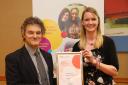 Dr Bruce Laurence presenting the Healthy Early Years award to Debbie Giles