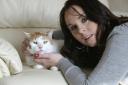 Emma Goodman with her cat Ben, who has been shot by an air rifle