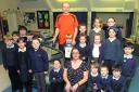 Andrew Hughes with his daughter Carys and Broad Hinton School pupils and head teacher Elizabeth Floyd