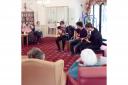 Music students from Cirencester College take time to perform for care home residents