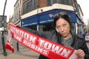 Swindon Town fan Carman Kummer outside TP's which has a ban on Town fans