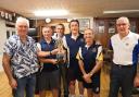Swindon 2019  Floodlight Tournament winners Westlecot B receive the trophy from left to right: Jim O’Leary (organiser), Kevin Carter (capt), John Thomas, Miles Roberts and Brian Whittingham, plus far right  Bob Hiles (Swindon president) who