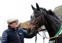 Trainer Nicky Henderson poses for a photo with Altior at Seven Barrows, Lambourn        Pic: PA