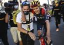 Stage winner Britain's Thomas Pidcock is taken to the podium after the twelfth stage of the Tour de France cycling race over 165.5 kilometers (102.8 miles) with start in Briancon and finish in Alpe d'Huez, France, Thursday, July 14, 2022. (Marco