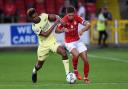 Swindon Town's Ellis Iandolo battles with an Arsenal U21 player during the EFL Trophy clash in 2021