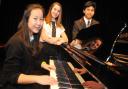 Preparing for the junior piano class are, from left, Christina Kwong, Olivia O’Brien and Raj Burman  Picture: DAVE COX