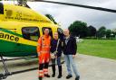 Sue Williams and her partner Dave Woodland with Wiltshire Air Ambulance Critical Care Paramedic Richard Miller at the airbase in Devizes.