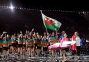 Swindon swimmer Jazz Carlin carries the Welsh flag as she leads out the team at today’s opening ceremony ahead of the Commonwealth Games, which get under way tomorrow