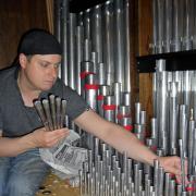 Anthony Hall working on the Holy Rood Church organ he has been playing for 30 years and first renovated nearly 20 years ago