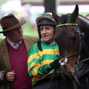 Barry Geraghty alongside Epatante and trainer Nicky Henderson following their victory in the Unibet Champion Hurdle Challenge Trophy on day one of the Cheltenham Festival at Cheltenham Racecourse, Cheltenham..