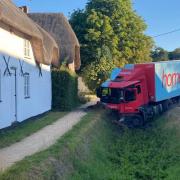 A Home Bargains lorry almost hit a thatched house on the A338 last month (Photo: SWNS)