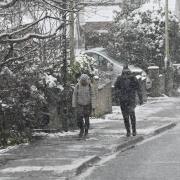Residents walking in Swindon during snow earlier this year.