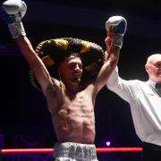 Swindon bantam weight Lewis Roberts has his arm raised after one of six professional wins