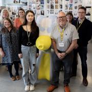 Mimi Salter with her Swindog sculpture and Arval UK staff