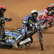 Jason Doyle (centre), Tai Woffinden (left), and Max Fricke in action during the 2022 Speedway GP of Great Britain