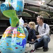 Two year old Lydia Wass and her father Chris meet Adventure Hound as part of The Big Dog Art Trail in Swindon
