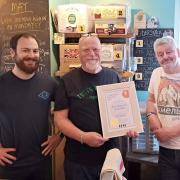 The Hop Inn bar manager Jack Arnold (left), barman Gary Hazell (centre) and owner Jason Putt (right) receive the Cider Pub of the Year award.