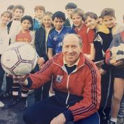Bobby Charlton with St Joseph’s Lower School pupils in Swindon in January 1988. Picture: Dave Waters