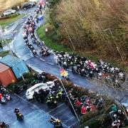 Bikers lined the streets as Santa's elves, hoping to deliver Christmas presents to children in hospital.