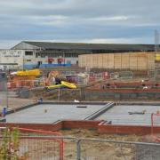 Homes are being constructed near Abbey Stadium, Swindon Borough Council is investigating whether a breach of planning permission has occurred