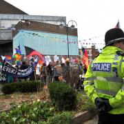 Dozens of police officers separated the two protest groups outside the Wyvern Theatre