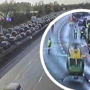 An air ambulance landed on the M4, while traffic queued for two miles.