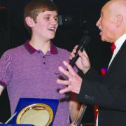 TALKING A GOOD GAME Josh McCarthy  receives his award and chats to host Clive Fisher