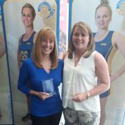 Raychem Netball Club’s Lynn Tomlin and Tracy Watt show off their Goalden Globe prizes