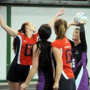 Action from the Division Three match between Raychem D and Purton A (purple and black) at the Dorcan Dome on Saturday