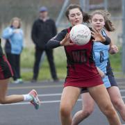 Lawn D’s Cerys Heath looks for a teammate during her side’s match against Croft E at Dorcan Dome on Saturday