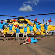 Royal International Air Tattoo volunteers with a Sea King helicopter