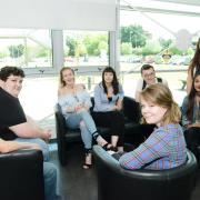 Kaylie Moroney and Alex O'Connor with fellow Swindon College students. Picture by Thomas Kelsey