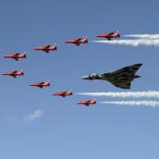 The Vulcan bomber takes its last flight at a previous RIAT, escorted by the Red Arrows. Picture: CLARE GREEN