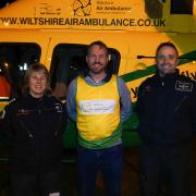 Matt Perry with Wiltshire Air Ambulance pilots Nicky Smith (left) and Matt Wilcock (right)