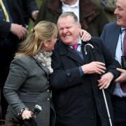 Trainer Emma Lavelle and Andrew Gemmell, owner of Paisley Park, celebrate winning the Stayers’ Hurdle at the Cheltenham Festival last Thursday, while (left) jockey Aidan Coleman raises his arm in the air after landing the feature race on day three