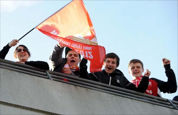 Swindon Town in action against Chesterfield at Wembley as fans cheer them on