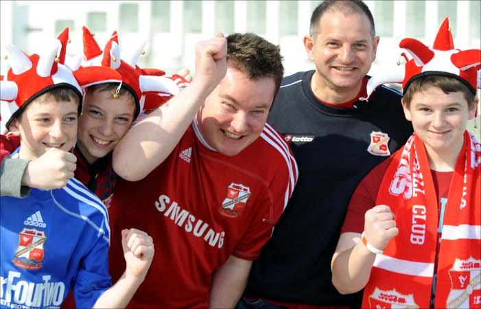 Thousands of fans in the Red and White Army of Swindon Town flock to Wembley to cheer on The Robins against Chesterfield
