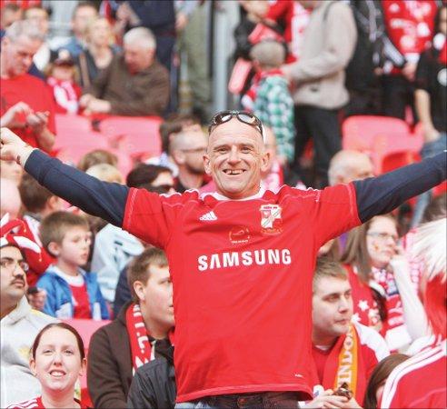 Thousands of fans in the Red and White Army flock to Wembley to cheer on Swindon Town against Chesterfield