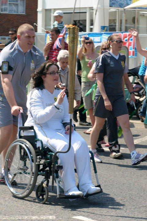 Your flame to fame. 
Readers' pictures capture memories of the Olympic Torch in town.
The torch being carried through Wootton Bassett - Vivien Blackmore