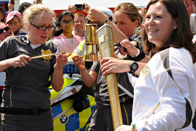 Your flame to fame. 
Readers' pictures capture memories of the Olympic Torch in town. - Olympic torch photos taken by Angela Freeman, 42 yrs -  on Kingshill Road, Swindon