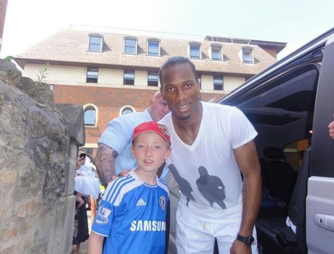 Your flame to fame. 
Readers' pictures capture memories of the Olympic Torch in town. Nine year old Jacob Jackson who is a huge Chelsea fan and Drogba his hero  whilst Drogba was having a sneaky toilet stop on the way home! 