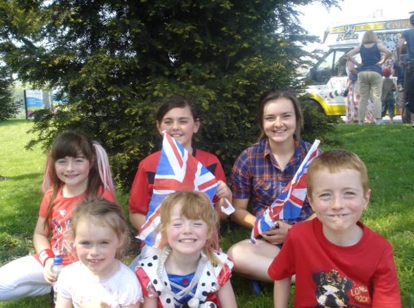 Your flame to fame. 
Readers' pictures capture memories of the Olympic Torch in town.
School children watch Olympic Torch in Chiseldon. - Rebecca Cox