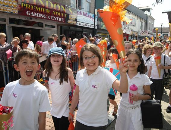 Holiday atmosphere as the famous Olympic Torch is paraded through Wiltshire
