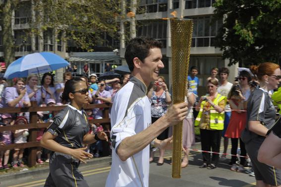 Thousands bask in the sun enjoying the spectacle of the Olympic Torch