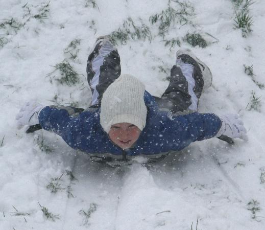 Children enjoying the snowy conditions at Penhill, Swindon 